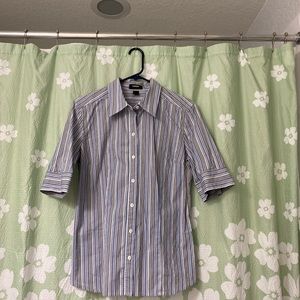 Express, 97% cotton/3%lycra. Mach wash/line dry